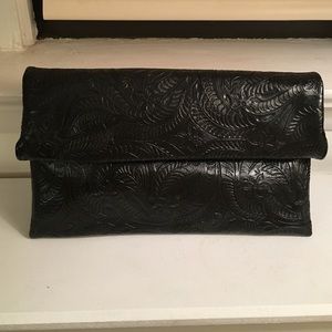 Black paisley embossed oversized clutch.