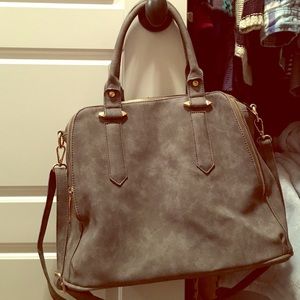 Dark grey purse with gold accents.