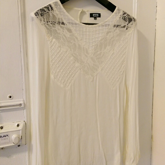 Ivory blouse with lace parts.