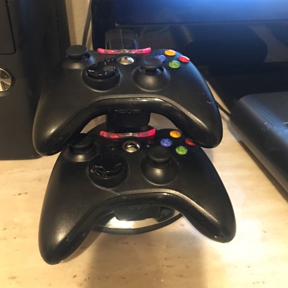 Xbox 360 with two controllers with a charger