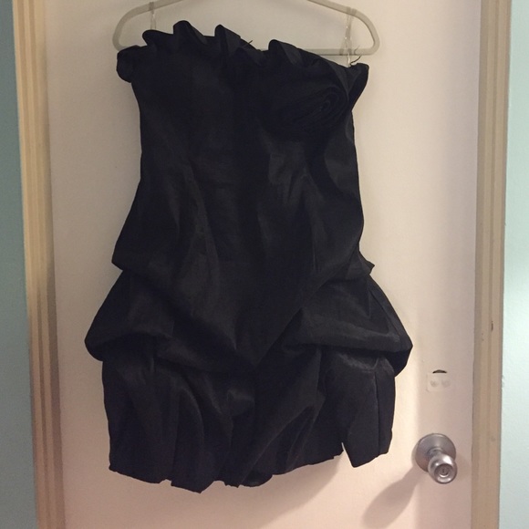 Sleeveless black mini length cocktail dress.