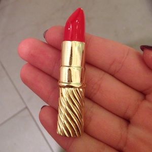 Gold and red lipstick pin