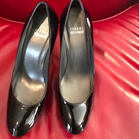 Stuart Weitzman 5" black patent platforms shoes.