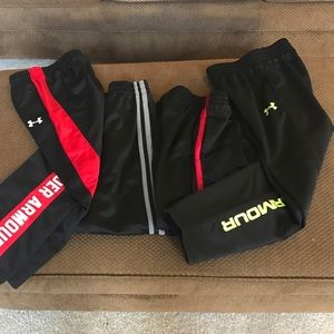 Four youth size 6-7 Under Armour & Starter pants