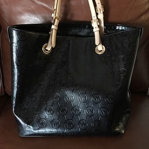 Large Michael Kors hand bag in black and cream.