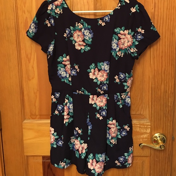 Navy blue jumper with flower design.