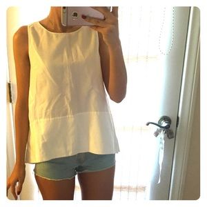 White cotton sleeveless blouse.