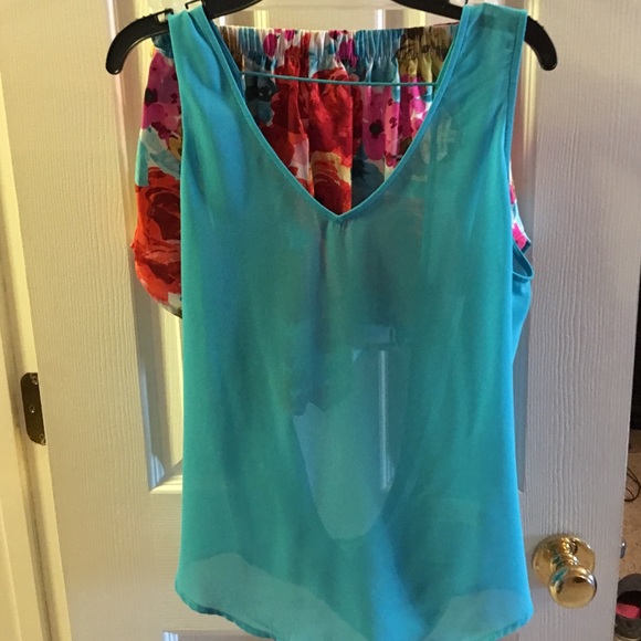 Teal tank with open back. Never been worn.