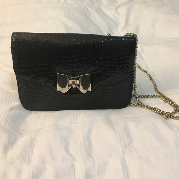 Black patent leather bow front cross body bag
