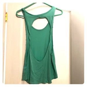 Teal open back shirt.