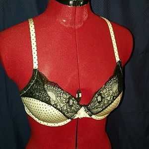 White polka dot and black lace bra