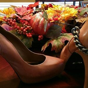 Fergie brown leather pumps