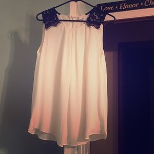 Cream blouse with black lace shoulders
