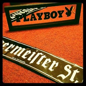 Playboy mirror sign and a jag lq sign