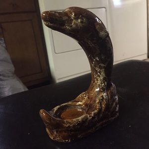 Brown dolphin candle holder