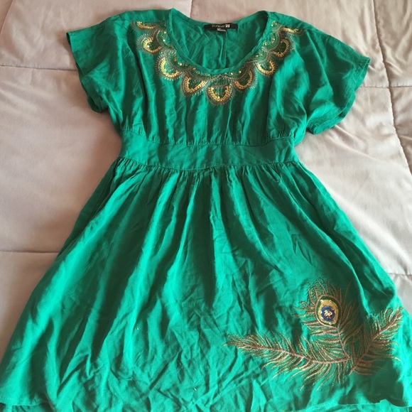 Green dress with peacock detailing