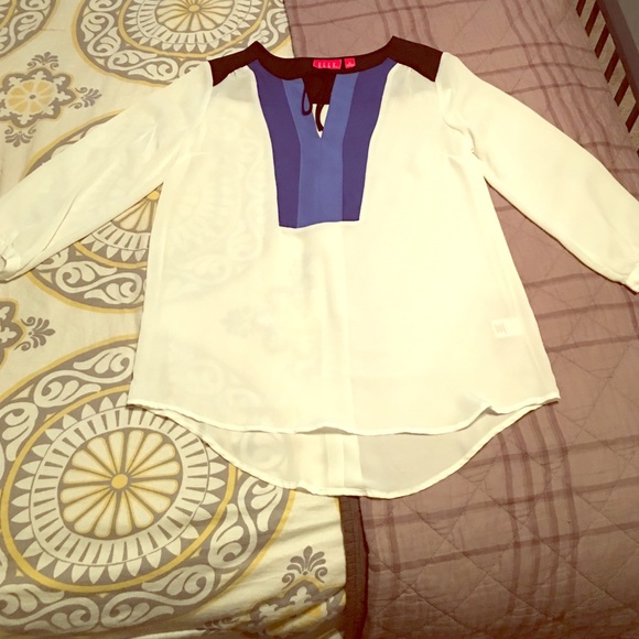 White, blue and black blouse