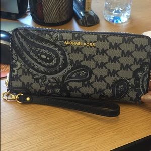 Authentic Michael Kors wristlet $175