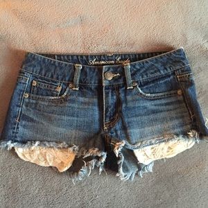 American Eagle dark wash shorts w/ floral pocket