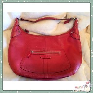 Red Pebble Leather COACH handbag.