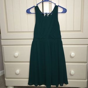 Emerald green, pleated dress.