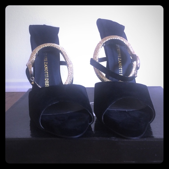 Black heels with gold snake ankle closure