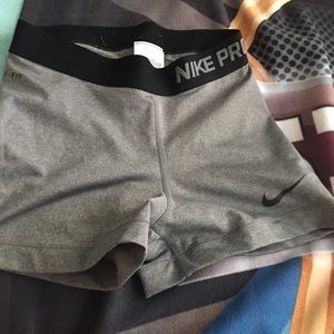 Grey Nike pros with black waistband