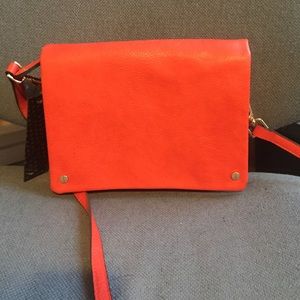 Street level over the shoulder bag. "Red"