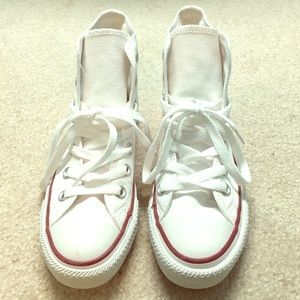 Whit high-top Converses.