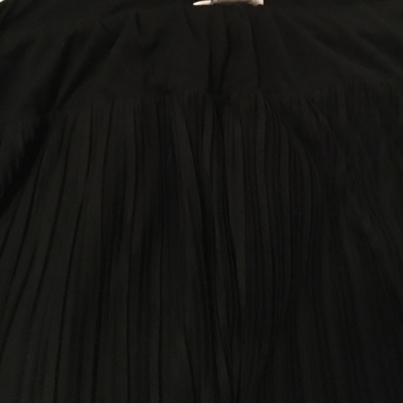 A pleated black skirt