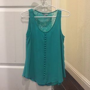 Green top with lace detail in the back.