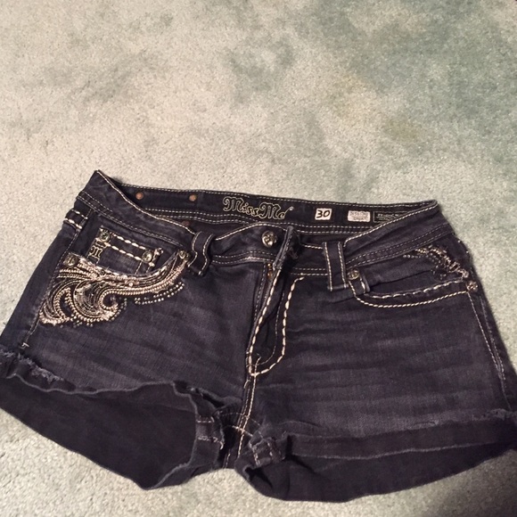 Black washed miss me jean shorts.