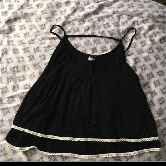 Black crop top with white lace bottoms.