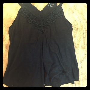 Black flowy low cut summer shirt.