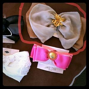 Chiffon bow on barrette with gold tone flower