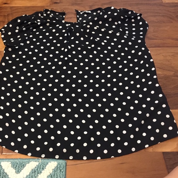2 blouse shirts, one polka dot other patterned.
