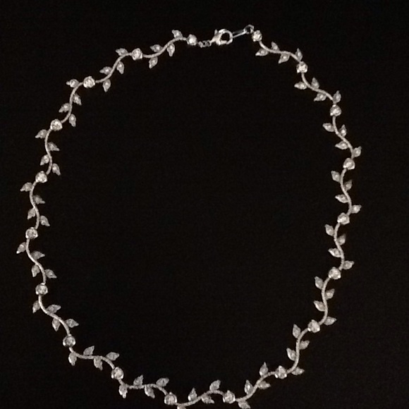 Necklace with leaves and stones.