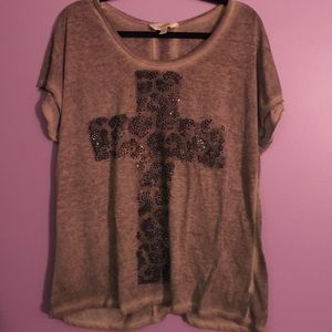 Brown shirt with a cheetah bedazzled cross.