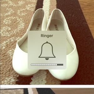 White faux leather flats