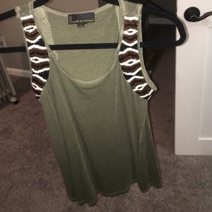 Small green tank with decorative beading