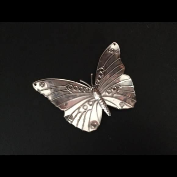 Silver Butterfly Pin with magnetic clasp.
