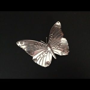 Silver Butterfly Pin with magnetic clasp.