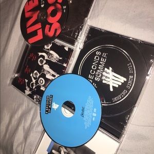 two 5 seconds of summer CDs