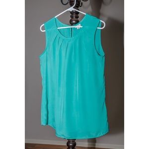 Sleeveless green top