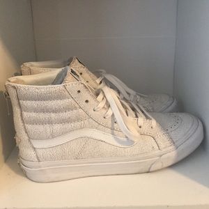 White high-top Vans sneakers