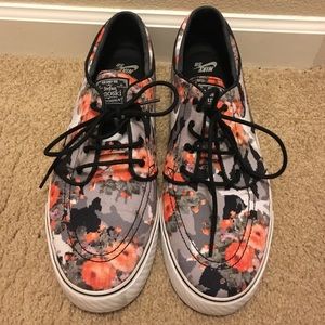 Nike black grey and orange floral print.