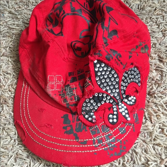 Red bejeweled hat.