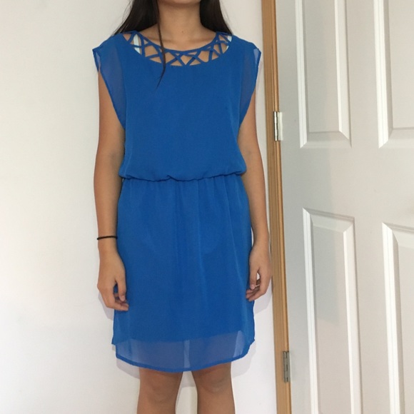 a blue dress with geometric cutouts