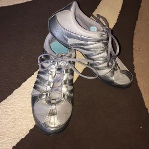 Grey metallic Nike running shoes