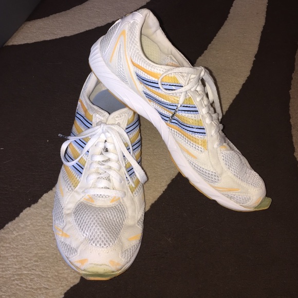 Adidas white, blue and yellow running shoes.